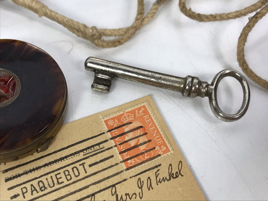 Vintage Lot Featuring An English Boatswain Whistle, Hand Wrought Bird Tray, 1946 Maiden Voyage Postcard Of Queen Elizabeth Ship, Vintage Brooch Pin, Ladies Compact, 3 Rings, Lacquer Box, Metal Box, Token, Copper Chalice And Mini Pocket Knife - See Photos [Photo 30]