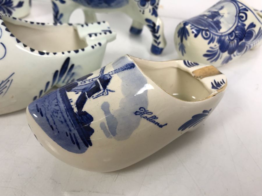 Delfts Blue Holland Pottery Lot: Includes (3) Clog Shoe Ashtrays, (1) Clog Shoe, (1) Clog Shoe Lighter And (1) Cow Creamer [Photo 3]