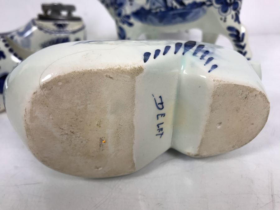 Delfts Blue Holland Pottery Lot: Includes (3) Clog Shoe Ashtrays, (1) Clog Shoe, (1) Clog Shoe Lighter And (1) Cow Creamer [Photo 12]
