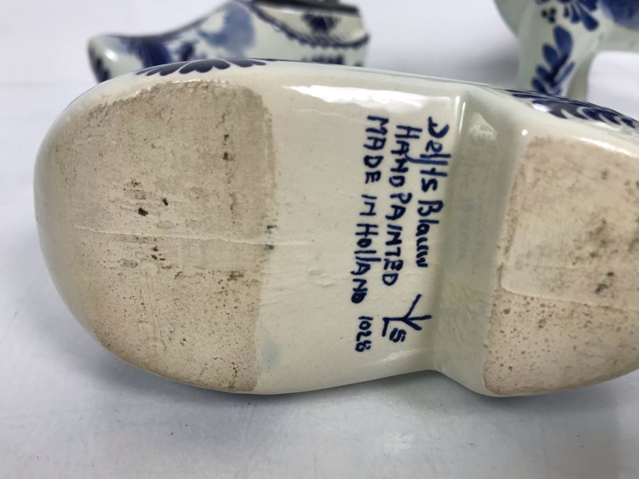 Delfts Blue Holland Pottery Lot: Includes (3) Clog Shoe Ashtrays, (1) Clog Shoe, (1) Clog Shoe Lighter And (1) Cow Creamer [Photo 13]