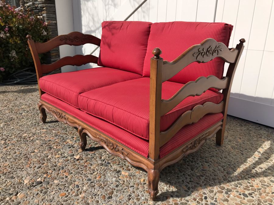 Stunning Wooden Loveseat With Red Upholstered Cushions