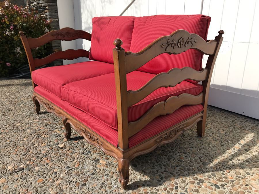 Stunning Wooden Loveseat With Red Upholstered Cushions