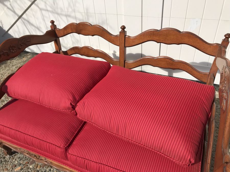 Stunning Wooden Loveseat With Red Upholstered Cushions