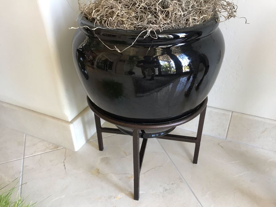 Large Faux Plant With Pot And Stand Shown In Middle [Photo 3]