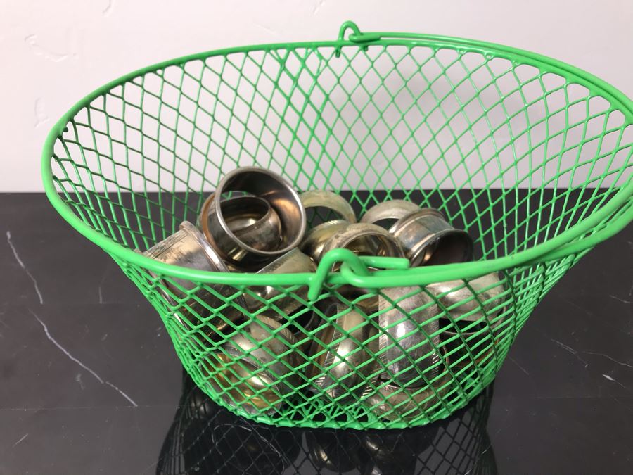 Green Metal Basket Filled With Silverplate Napkin Holders [Photo 1]