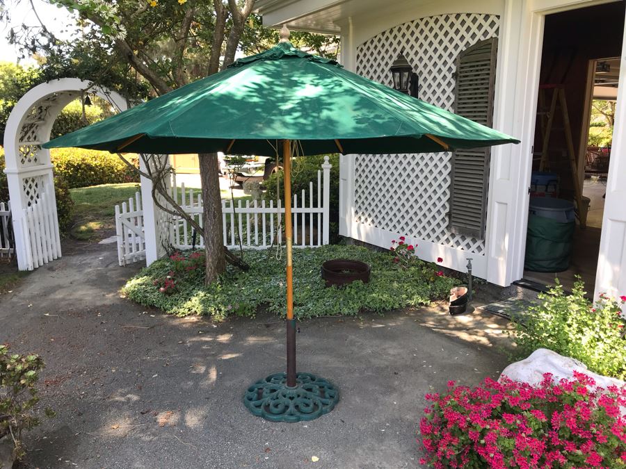 Sunbrella Outdoor Umbrella With Cast Iron Umbrella Stand [Photo 1]