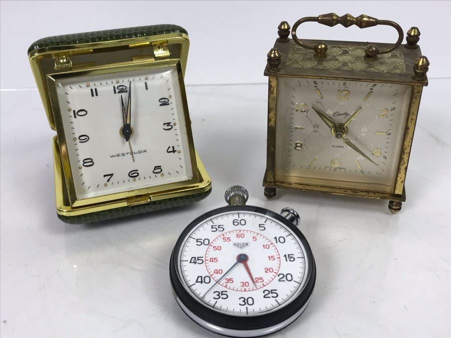 Heuer Stopwatch, Westclox Portable Alarm Clock And Bradley Portable Alarm Clock