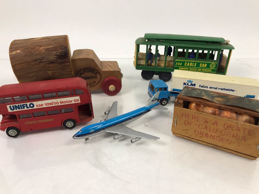 San Francisco Cable Car, California Redwood Logger Wooden Truck, KLM Boeing 747, KLM Truck, England Budgie Toy Double-Decker Bus, Oranges