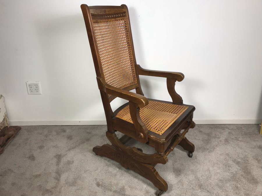 Antique Eastlake Cane Rocking Chair On Metal Casters [Photo 1]