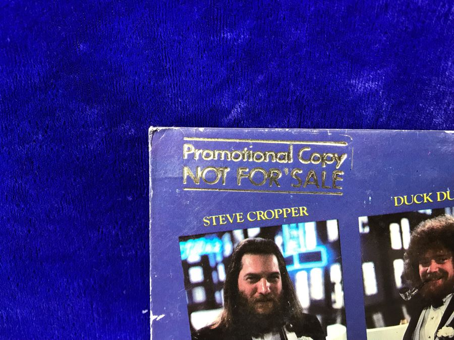 Vintage 1980 The Blues Brothers Movie Memorabilia Lot: Promo Vinyl Record, Sealed Cassette Tape, Button, 1979 Movie Concert Sticker, Blues Brothers Album Sticker, Bluesmobile Die-Cast Metal Replica Car On Damaged Card, And Private Perigee Book [Photo 10]