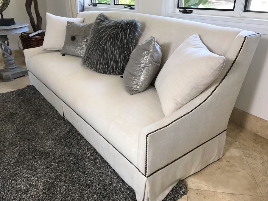 Classy Contemporary White Cream Sofa With Brass Nailheads And Five Throw Pillows 8'W X 37'D X 35'H [Photo 3]