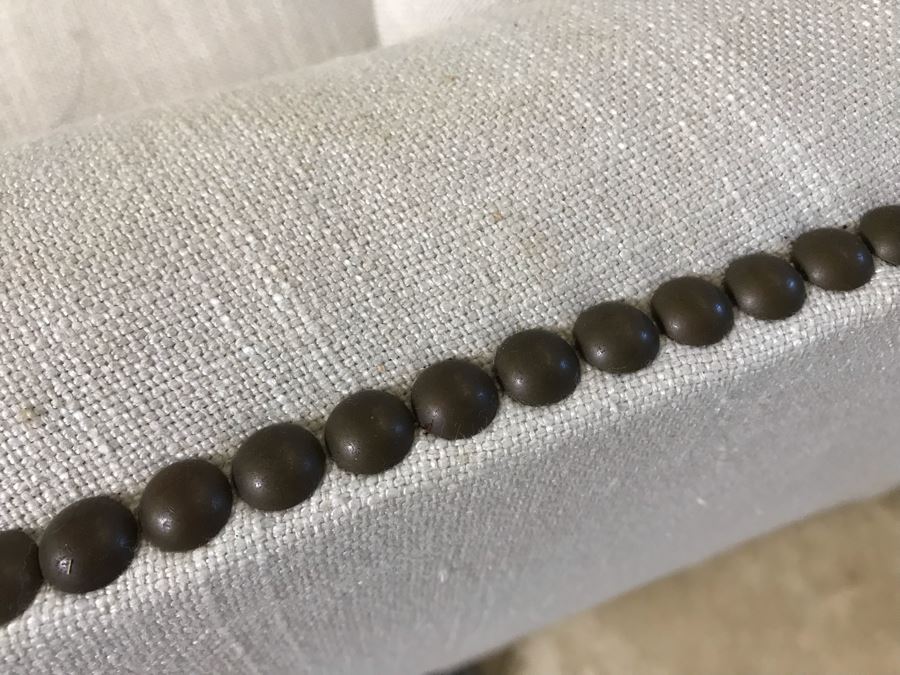 Classy Contemporary White Cream Sofa With Brass Nailheads And Five Throw Pillows 8'W X 37'D X 35'H [Photo 5]