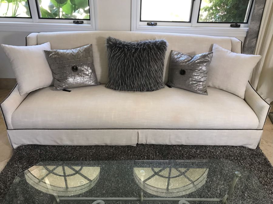 Classy Contemporary White Cream Sofa With Brass Nailheads And Five Throw Pillows 8'W X 37'D X 35'H [Photo 2]