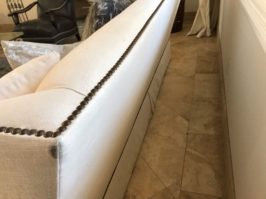 Classy Contemporary White Cream Sofa With Brass Nailheads And Five Throw Pillows 8'W X 37'D X 35'H [Photo 7]