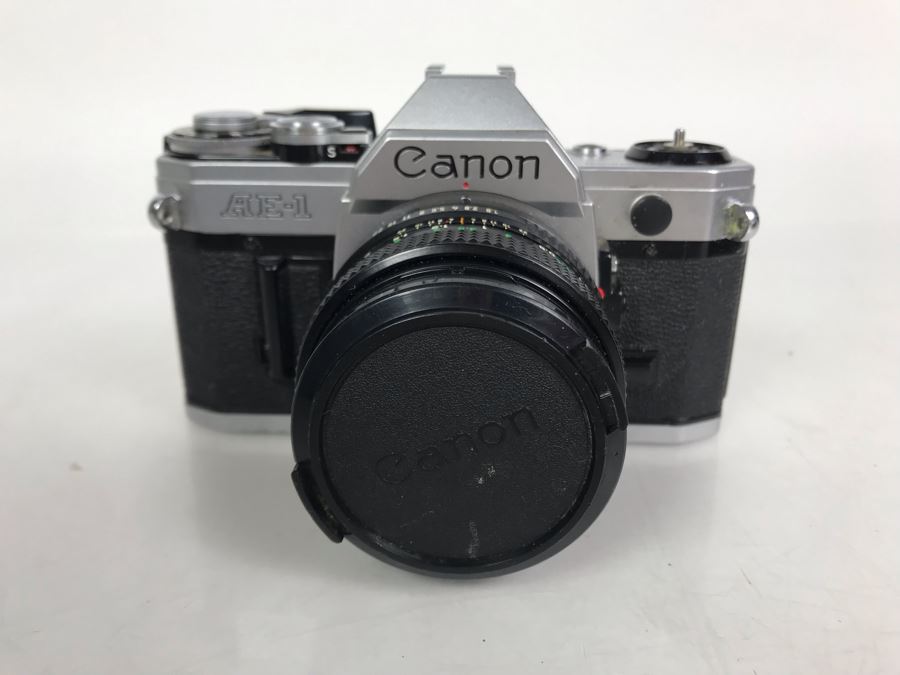 Canon AE1 Camera With Pair Of Lenses, Flash And Camera Bag