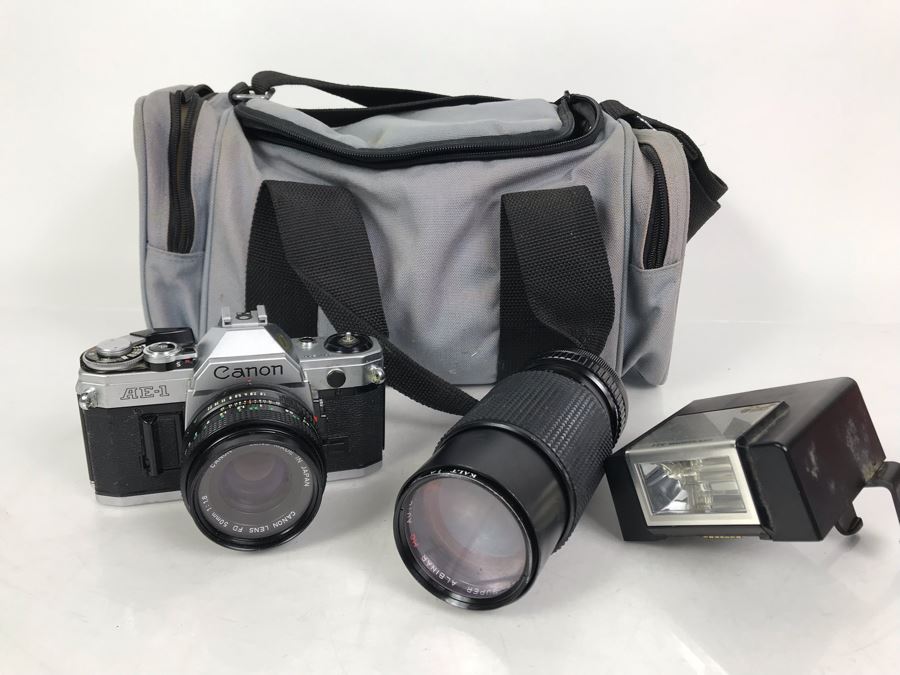 Canon AE-1 Camera With Pair Of Lenses, Flash And Camera Bag [Photo 1]