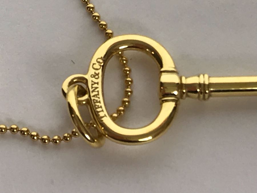 18K Gold Tiffany & Co .750 Key Pendant With 18K Gold Tiffany & Co. Necklace 5.4g Estimate $2,500 [Photo 6]