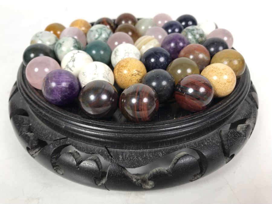 Collection Of Various Polished Stone Marbles With Wooden Stand