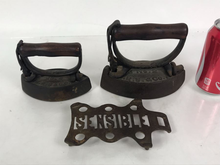 Pair Of Sensible Cast Iron Irons With Sensible Iron Trivet [Photo 1]