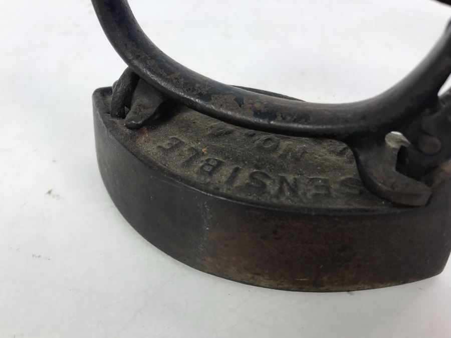 Pair Of Sensible Cast Iron Irons With Sensible Iron Trivet [Photo 11]