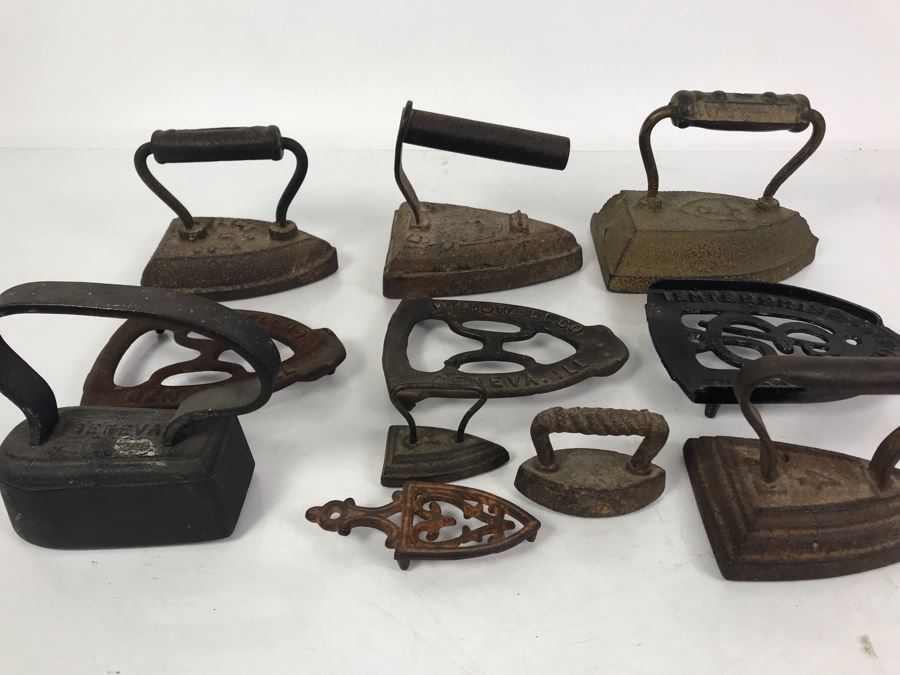 Collection Of (7) Antique Cast Iron Irons And (4) Antique Iron Trivets [Photo 1]