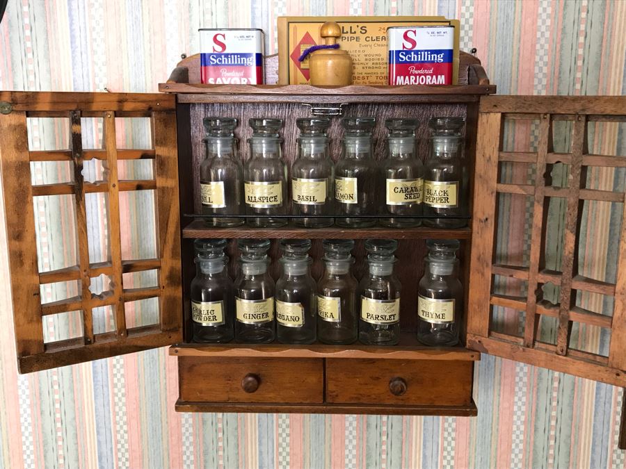 Vintage Wooden Wall Mounted Spice Rack With Various Spice Bottles Tins