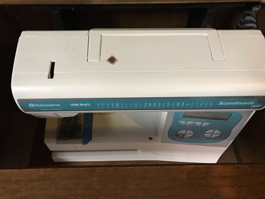 Mega Sewing Lot: Includes Husqvarna Viking Scandinavia 200 Sewing Machine Made In Sweden, Husqvarna Huskylock 560 Sewing Machine, Tons Of Sewing Supplies And Wooden Sewing Cabinet With Motorized Lift 46W X 20D X 32H - See Photos [Photo 17]