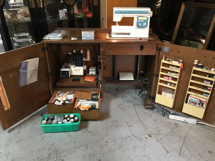 Mega Sewing Lot: Includes Husqvarna Viking Scandinavia 200 Sewing Machine Made In Sweden, Husqvarna Huskylock 560 Sewing Machine, Tons Of Sewing Supplies And Wooden Sewing Cabinet With Motorized Lift 46W X 20D X 32H - See Photos [Photo 1]