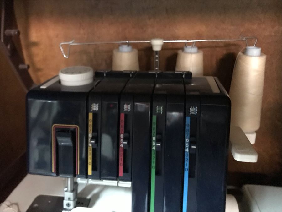 Mega Sewing Lot: Includes Husqvarna Viking Scandinavia 200 Sewing Machine Made In Sweden, Husqvarna Huskylock 560 Sewing Machine, Tons Of Sewing Supplies And Wooden Sewing Cabinet With Motorized Lift 46W X 20D X 32H - See Photos [Photo 16]