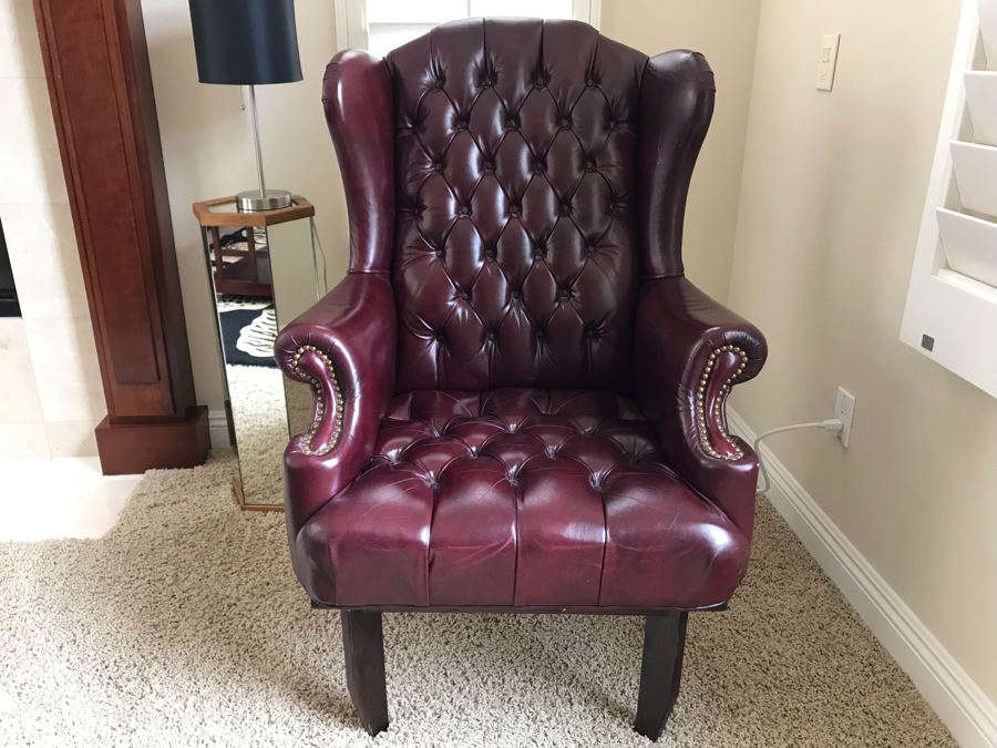 Classy Burgundy Tufted Leather Wingback Chair With Brass Nailhead Trim 29W X 27D X 46H [Photo 1]