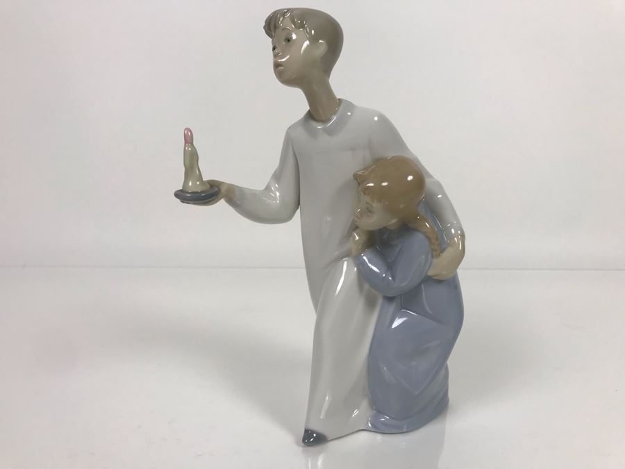 JUST ADDED - Lladro Porcelain Figurine Of Boy Holding Candle With Girl 9.5W X 8H (MOE) [Photo 1]