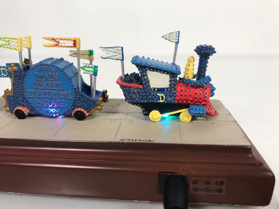 HAND SIGNED By Robert Olszewski Disneyland Main Street, USA Collection: First Edition Main Street Electrical Parade (Set #1) By Robert Olszewski Disney Theme Park Attraction Miniature Model With Box And COA 12W X 2.75D X 3H DL0601 (Estimate $300-$700) [Photo 18]