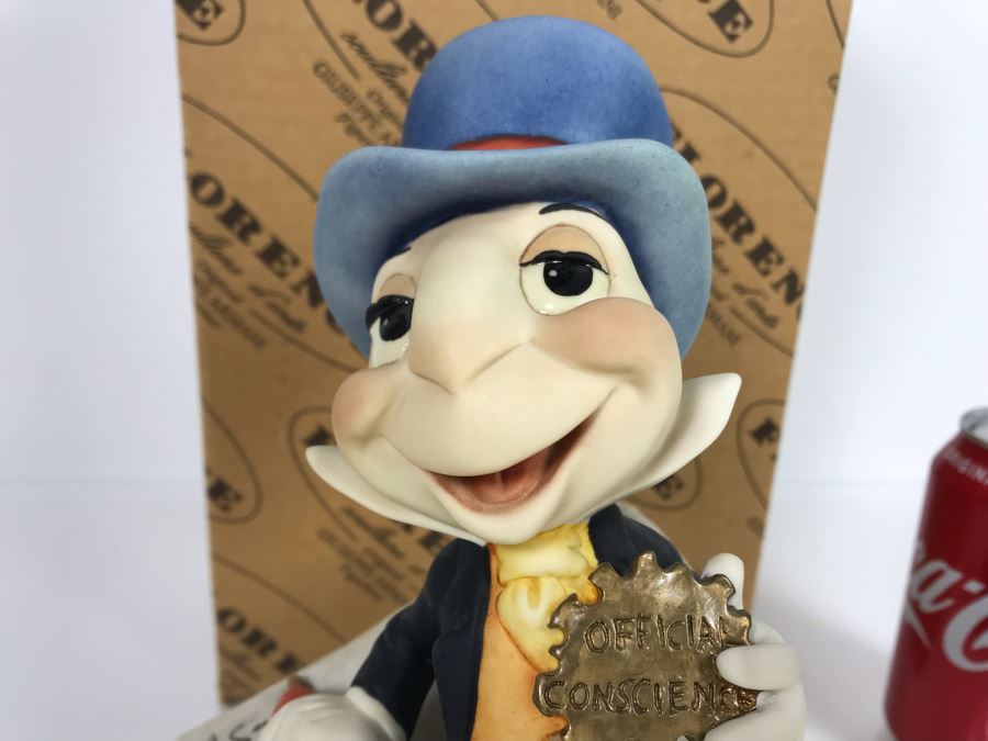 jiminy cricket garden statue