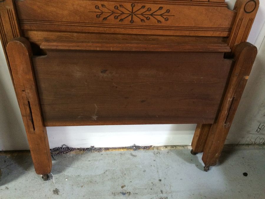 Vintage Child's Wooden Carved Bed on Metal Casters [Photo 9]