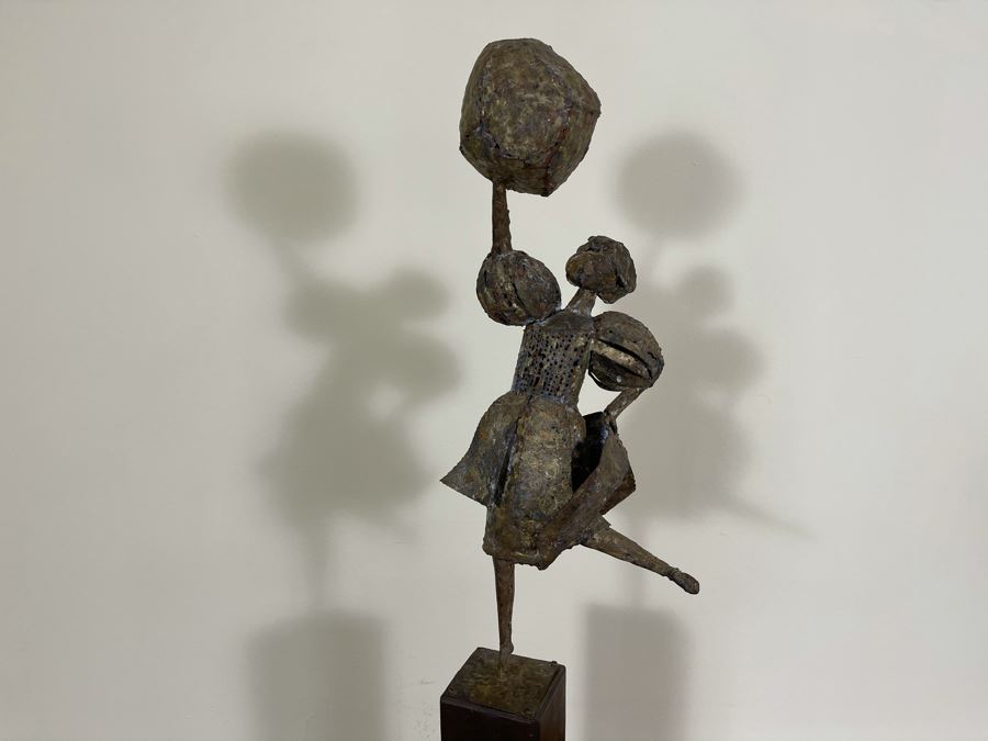 Metal Sculpture Of Woman Holding Up Ball On Wooden Base [Photo 13]