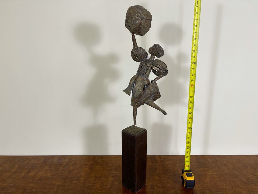 Metal Sculpture Of Woman Holding Up Ball On Wooden Base [Photo 2]