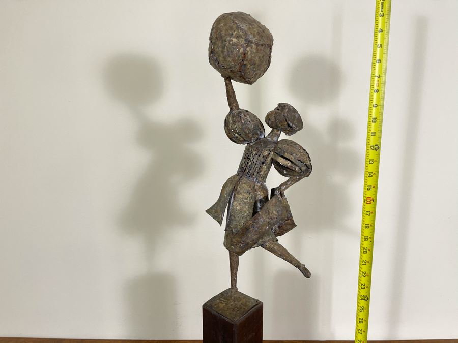 Metal Sculpture Of Woman Holding Up Ball On Wooden Base [Photo 3]