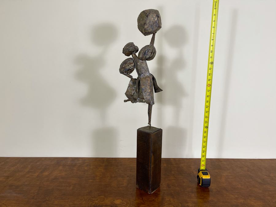 Metal Sculpture Of Woman Holding Up Ball On Wooden Base [Photo 9]
