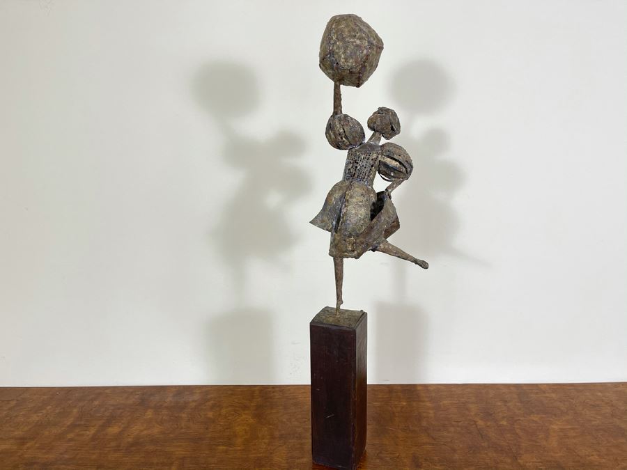Metal Sculpture Of Woman Holding Up Ball On Wooden Base [Photo 12]