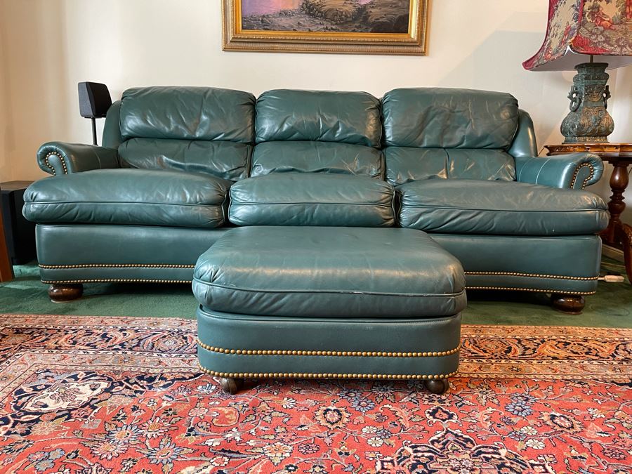 leather sofa with brass nailheads