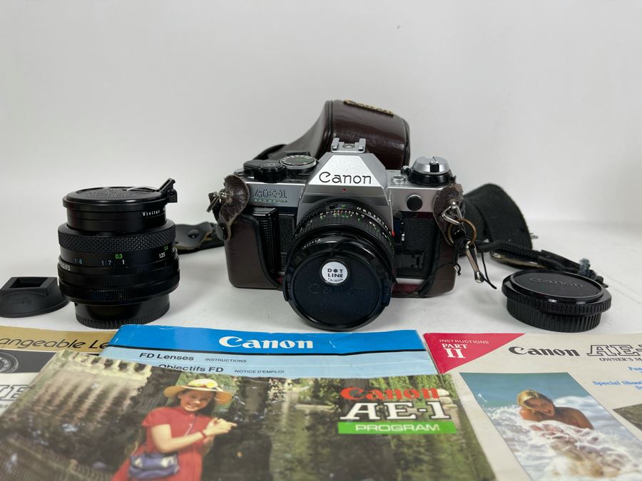 Vintage Canon AE-1 Film Camera With Additional Lens And Manuals [Photo 1]