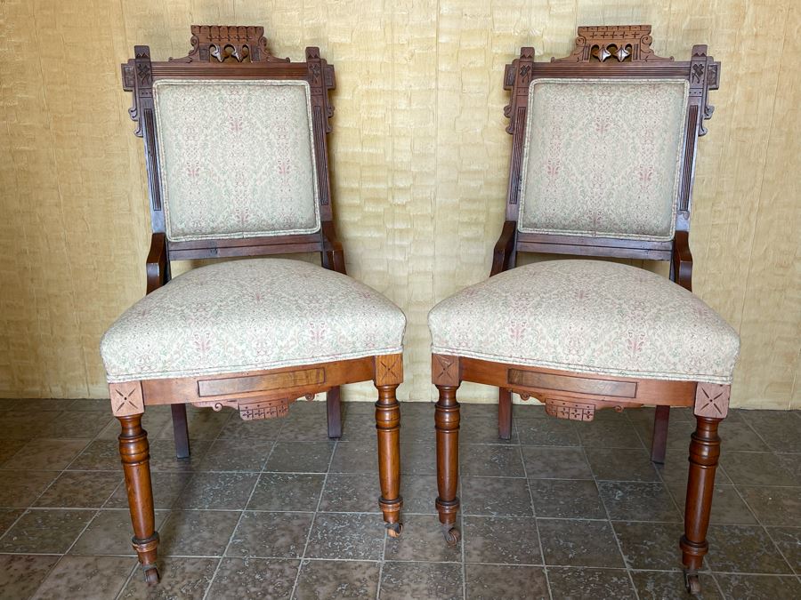 Pair Of Antique Eastlake Victorian Era Carved Wooden Side Chairs On Casters [Photo 1]