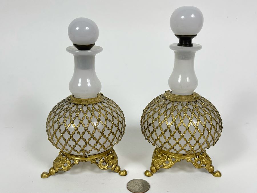 Pair Of Vintage Footed Milk Glass Perfume Bottles With Gilt Metal Overlay 6.5H And 7.5H