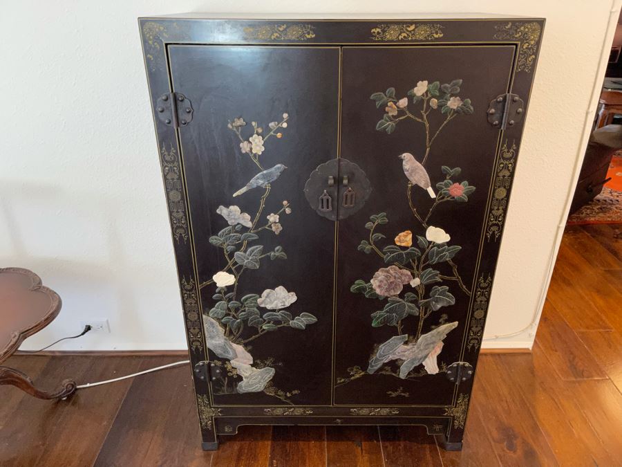 Black And Gold Chinese Wooden Cabinet With Relief Carved Semiprecious Stones Birds And Floral Decorations 2’10”W X 1’6”D X 4’4”H [Photo 1]