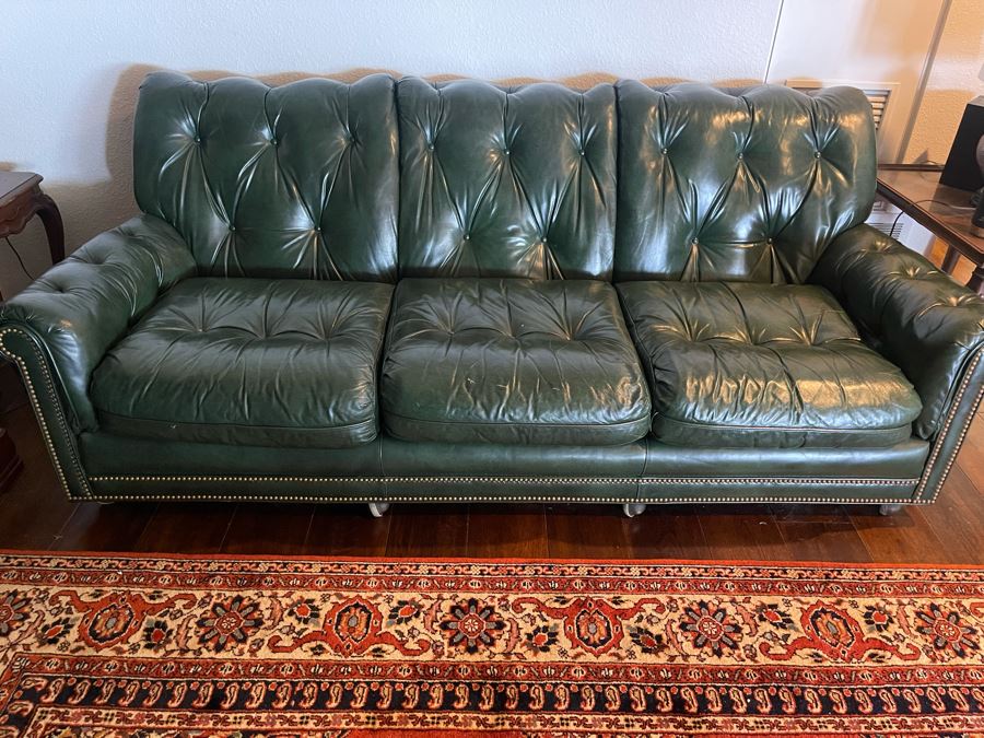 Hancock & More Green Tufted Leather Sofa With Brass Nailhead Trim On Casters 7’3”W X 3’5”D X 2’9”H [Photo 1]