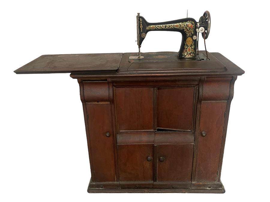 Antique Singer Sewing Machine No. 66 With Wooden Cabinet And Original Singer Instruction Book Dated 1920 In Italian And Some Sewing Supplies In Cabinet Drawers 32W X 17D X 40H