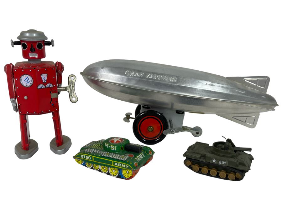 Various Toys Including Wind-Up Schylling Robot, Tanks And Graf Zepplin [Photo 1]