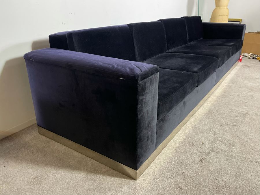 Modernist Long Sofa With Wooden Chrome Finish Base - Armrests Open Up For Storage And Electrical (Depending On The Light It's Black Or Deep Navy) 11.5'L X 38'D X 30'H (HE) [Photo 8]