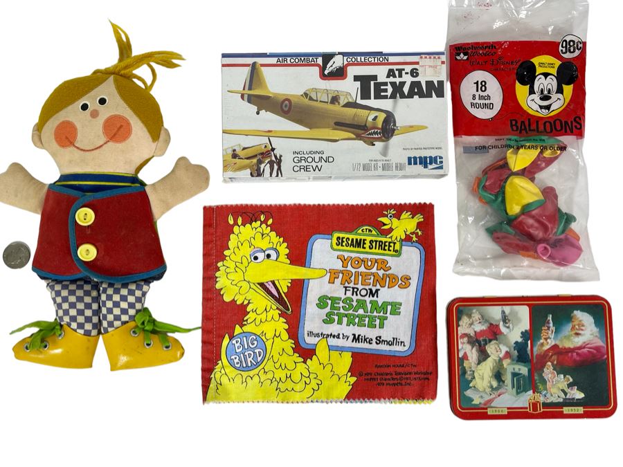 Vintage Dapper Dan Teaching Doll, New Coca-Cola Playing Cards, New Model Airplane, Sesame Street Cloth Book And New Walt Disney Character Balloons [Photo 1]