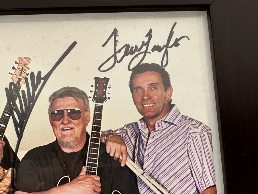 Autographed Color Photograph Of The Surf Music Band The Ventures With